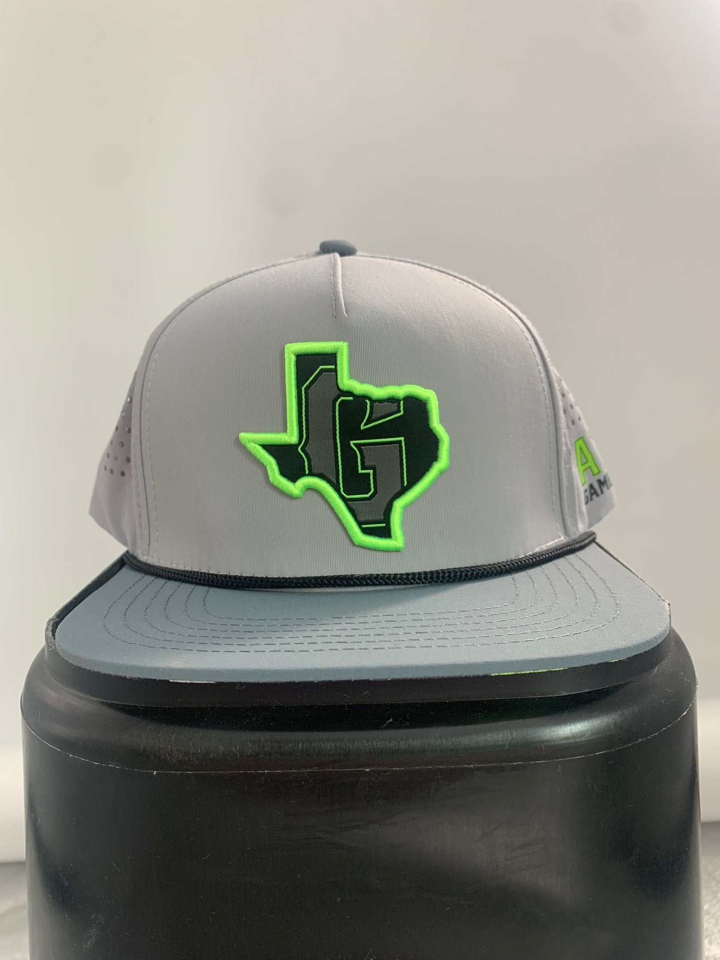 Austin Gamblers Texas G hat with rope across the space where the bill meets the crown